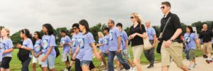 AEOP Volunteers walking with students